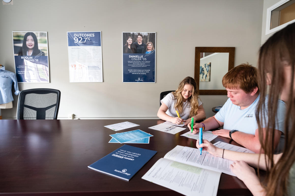 Marietta College students fill out paper work in the Career Center